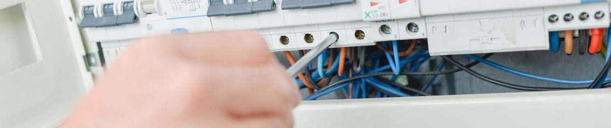 Electrician repairing a fuse Electrician repairing a fuse